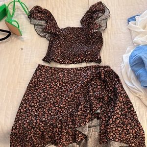 Black/red floral crop/ruffle wrap skirt set.